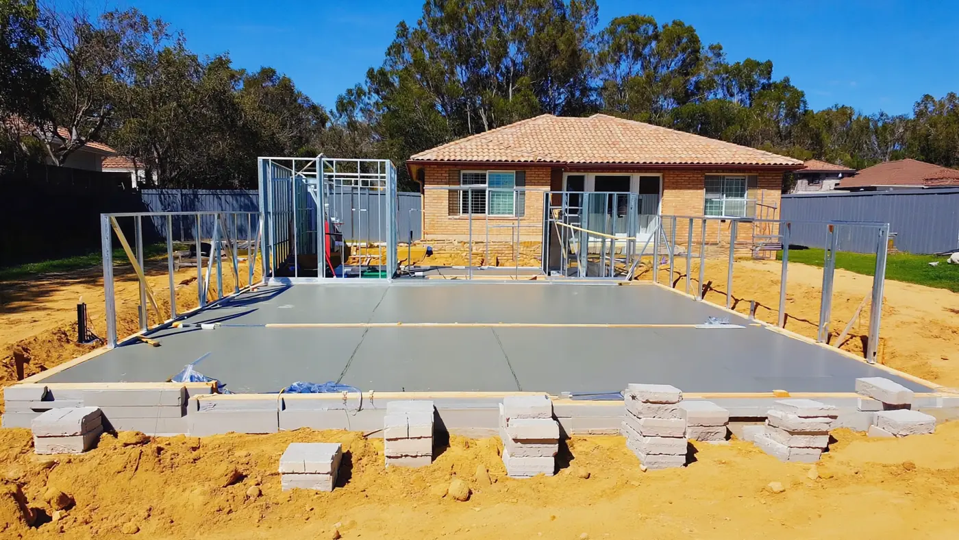 A granny flat slab and steel frame on sandy soil in a Perth backyard